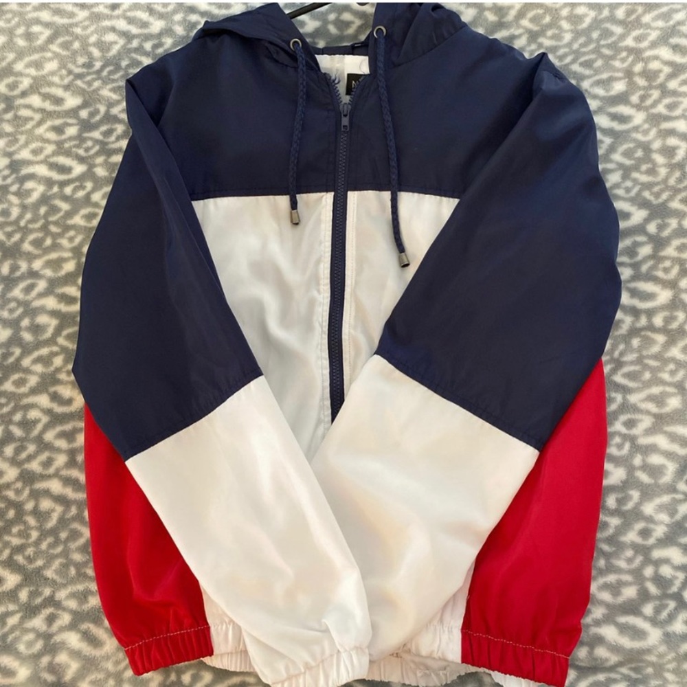 red, white, and blue wind breaker